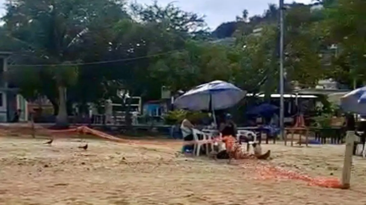 Tourists prevented from setting up on the stretch of sand at Manzanillo Beach.